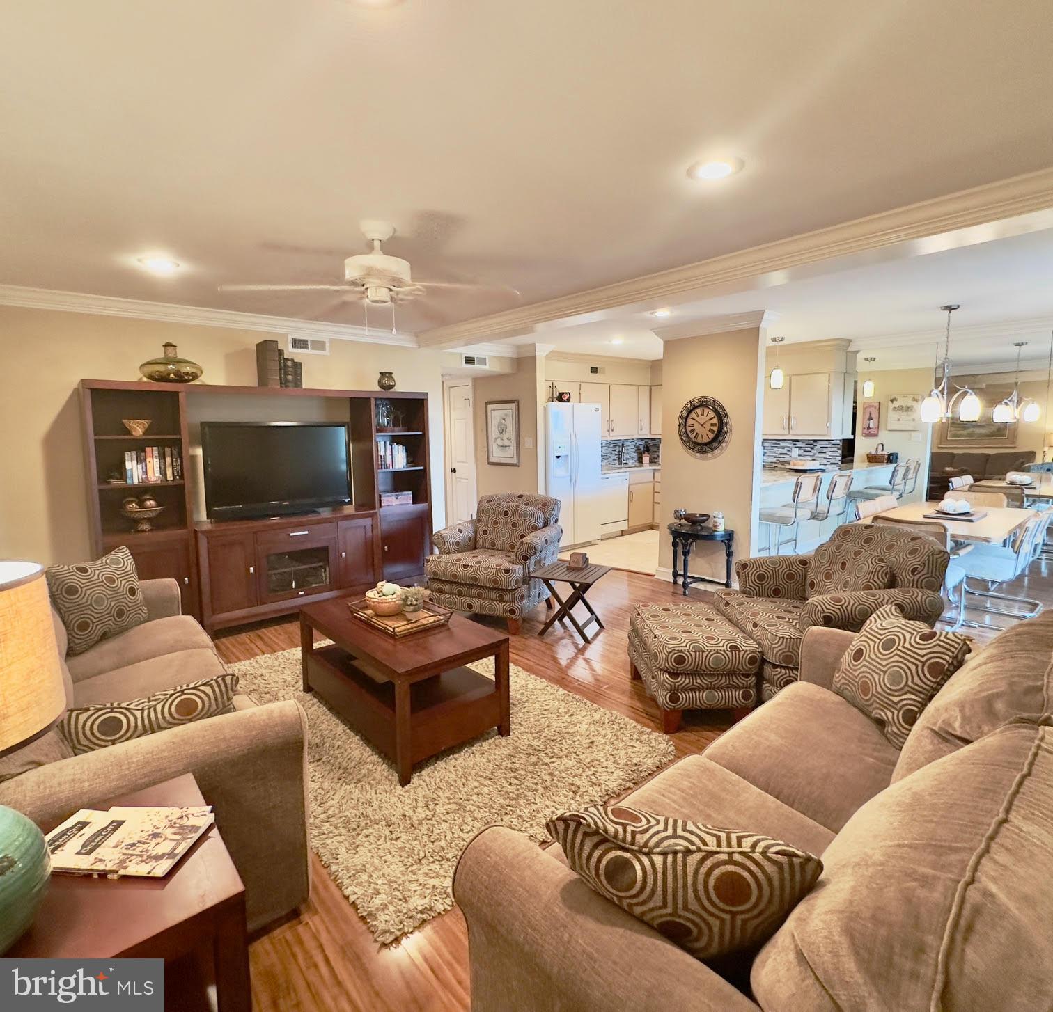 119 Old Landing Road, Unit E203 Ocean City, MD 21842 - Photo 20 of 45 a living room with furniture and a flat screen tv