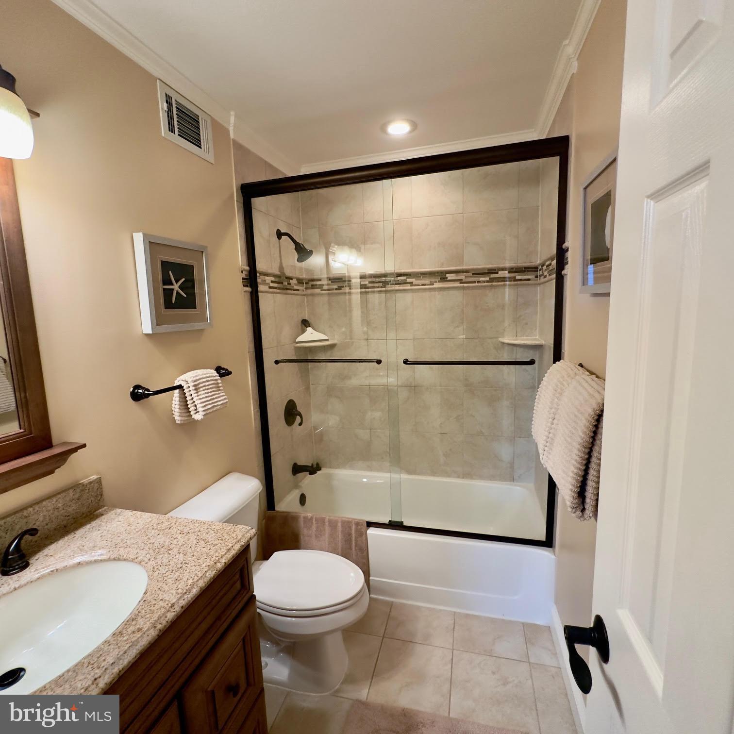 119 Old Landing Road, Unit E203 Ocean City, MD 21842 - Photo 23 of 45 a bathroom with a toilet and a shower