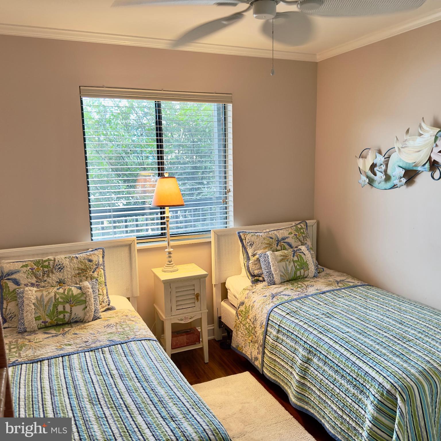 119 Old Landing Road, Unit E203 Ocean City, MD 21842 - Photo 25 of 45 a bedroom with a bed and a potted plant