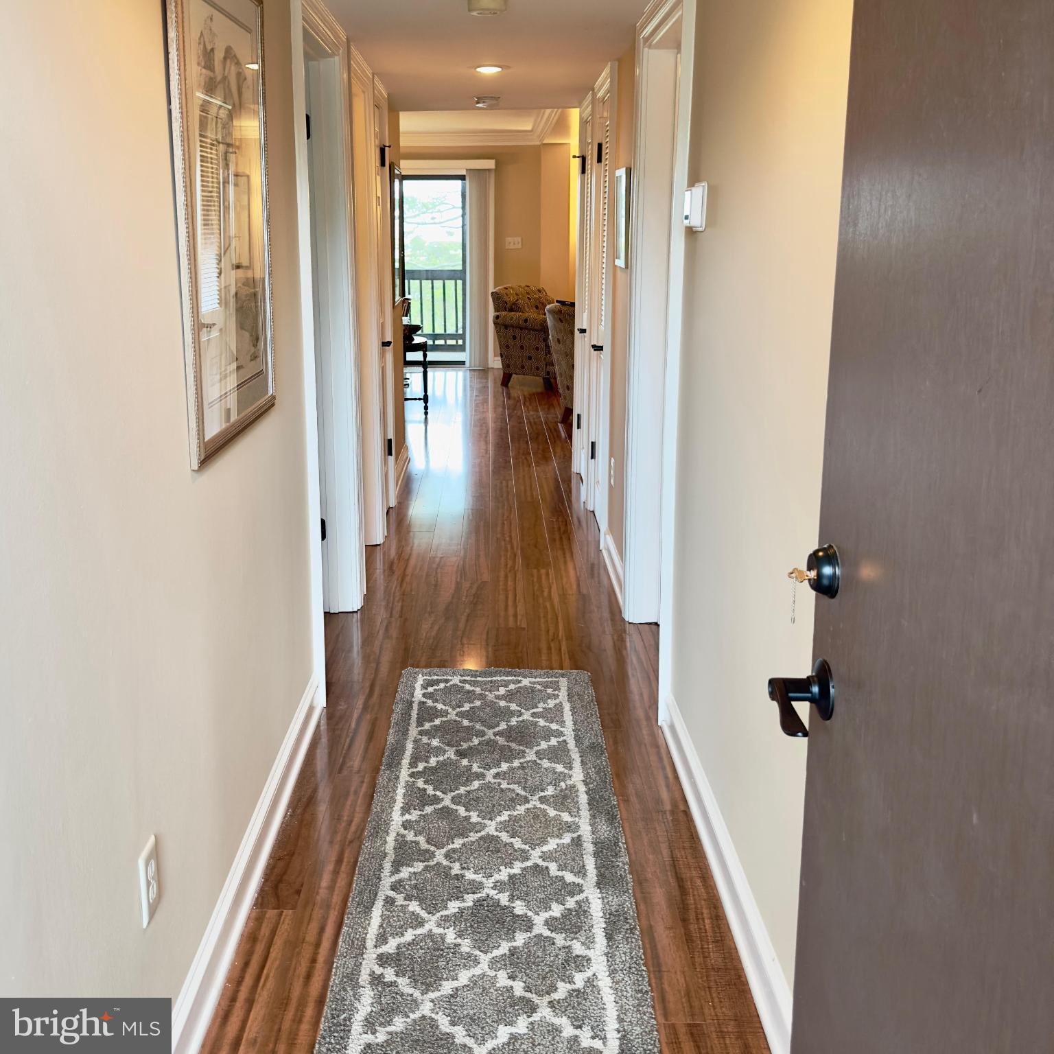 119 Old Landing Road, Unit E203 Ocean City, MD 21842 - Photo 29 of 45 view of a hallway with wooden floor and staircase