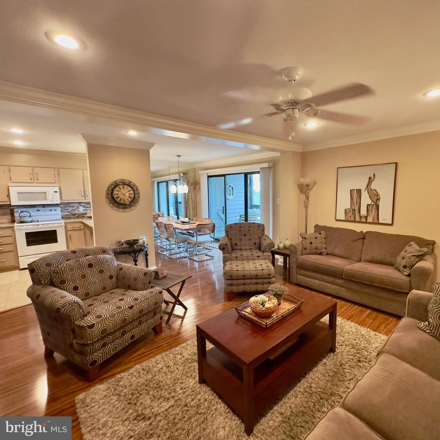 119 Old Landing Road, Unit E203 Ocean City, MD 21842 - Photo 3 of 45 a living room with furniture a rug and a window