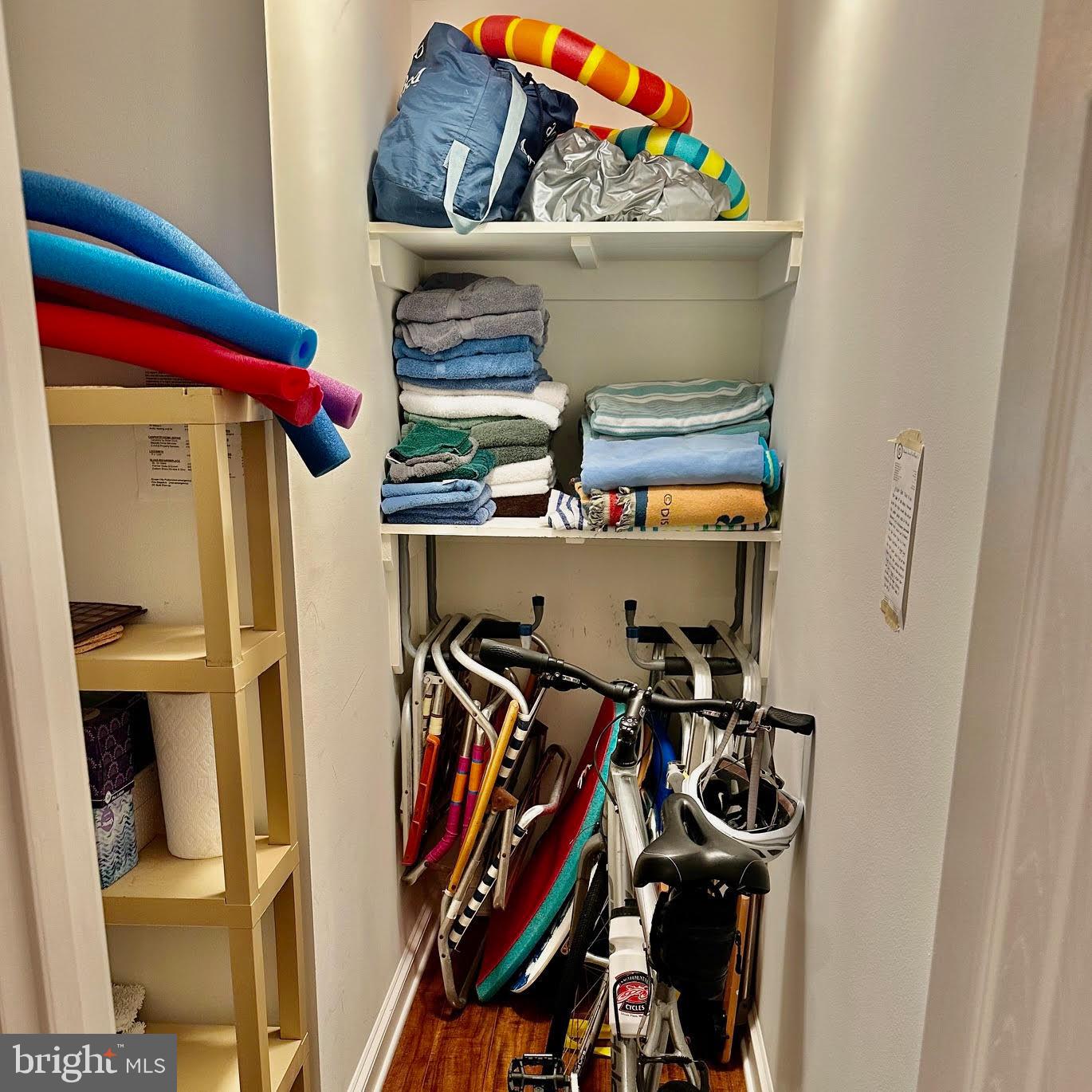119 Old Landing Road, Unit E203 Ocean City, MD 21842 - Photo 31 of 45 a view of walk in closet with clothes and shoes