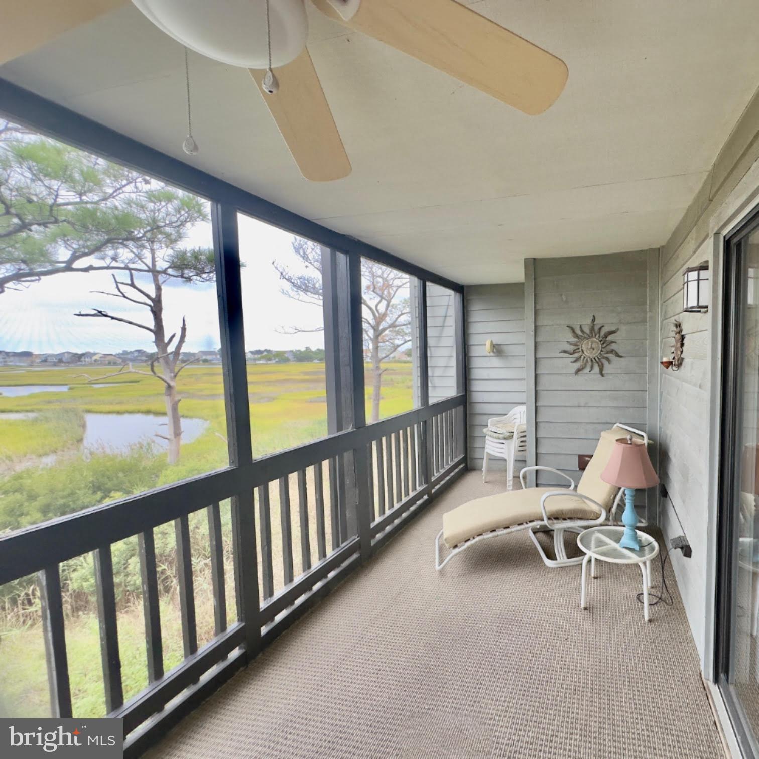 119 Old Landing Road, Unit E203 Ocean City, MD 21842 - Photo 7 of 45 a view of a room with furniture and floor to ceiling window