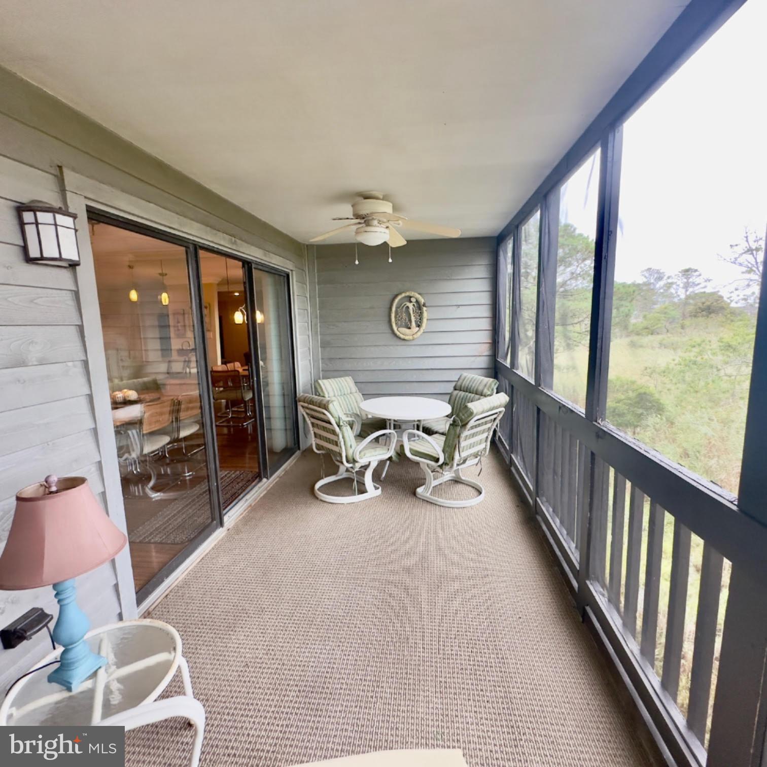 119 Old Landing Road, Unit E203 Ocean City, MD 21842 - Photo 8 of 45 a living room with furniture and a large window
