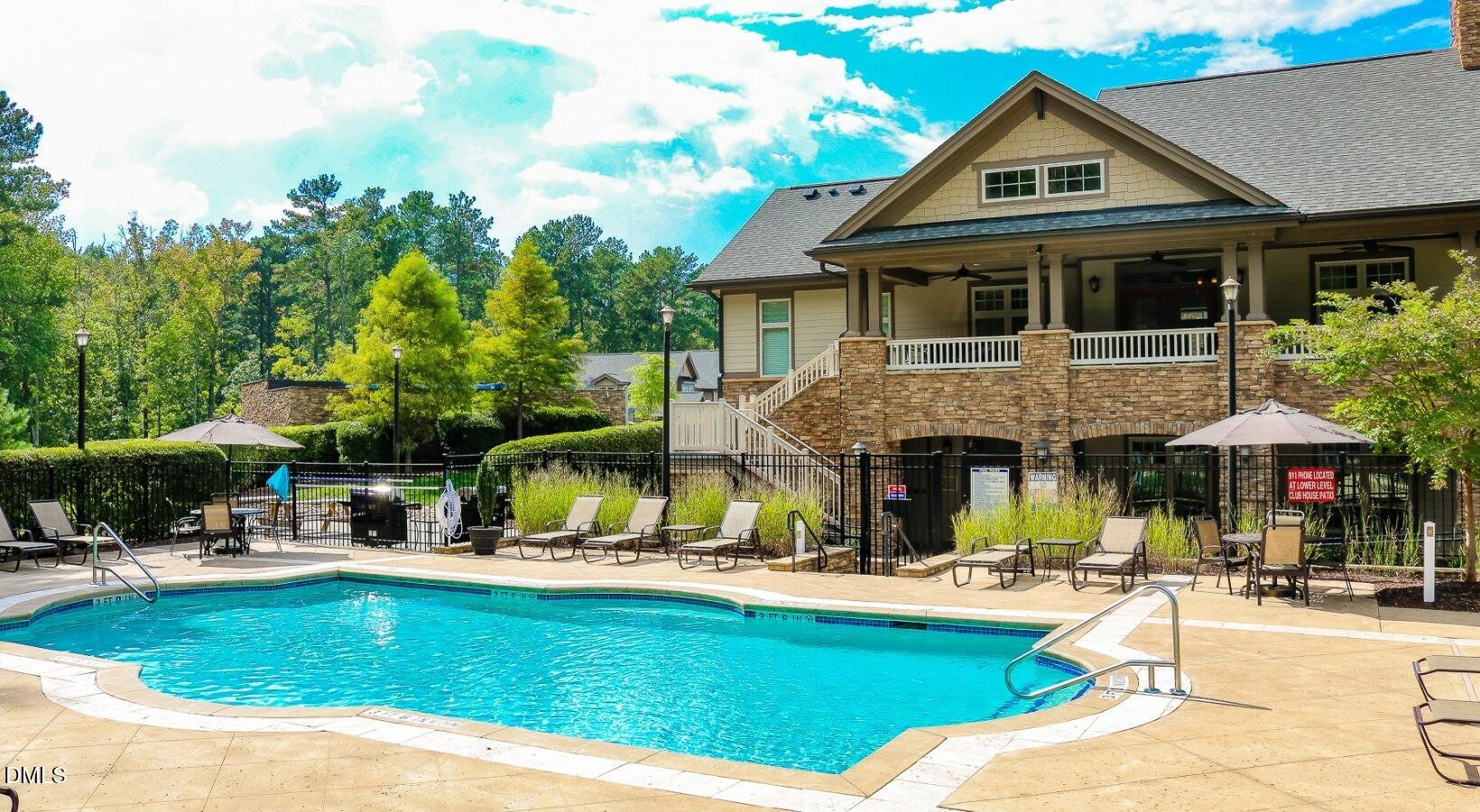 100 Ginkgo Trail, Unit ROSEMARY Chapel Hill, NC 27516 - Photo 14 of 49 a front view of a house with swimming pool having outdoor seating