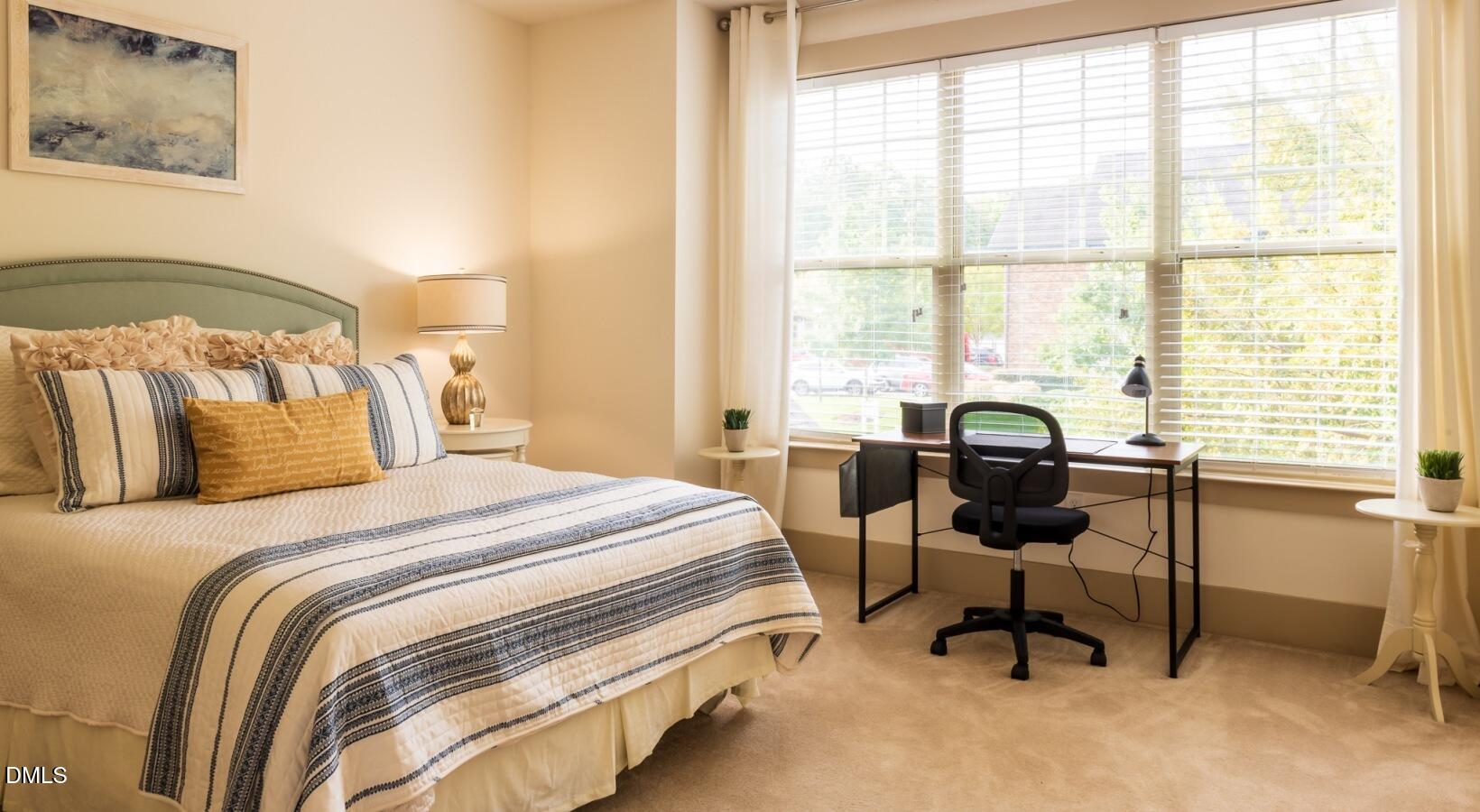 100 Ginkgo Trail, Unit ROSEMARY Chapel Hill, NC 27516 - Photo 38 of 49 a bedroom with a bed and a window