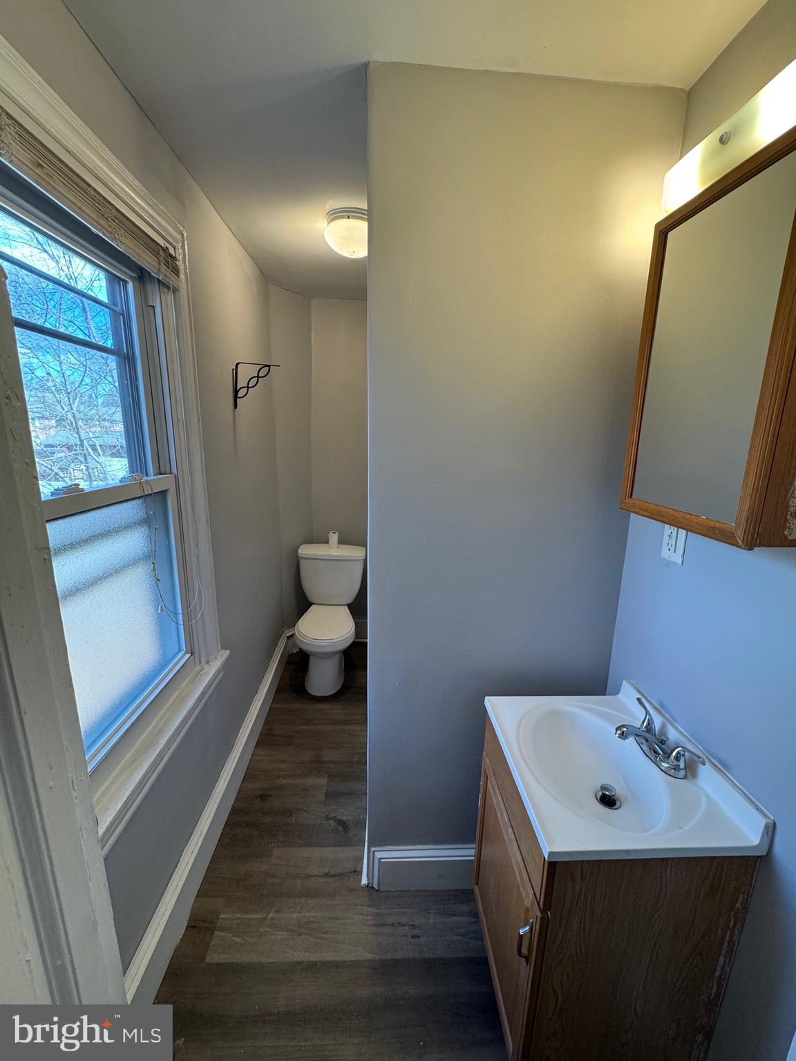 729 East Haverford Road Bryn Mawr, PA 19010 - Photo 11 of 15 a bathroom with a sink a toilet a mirror and window