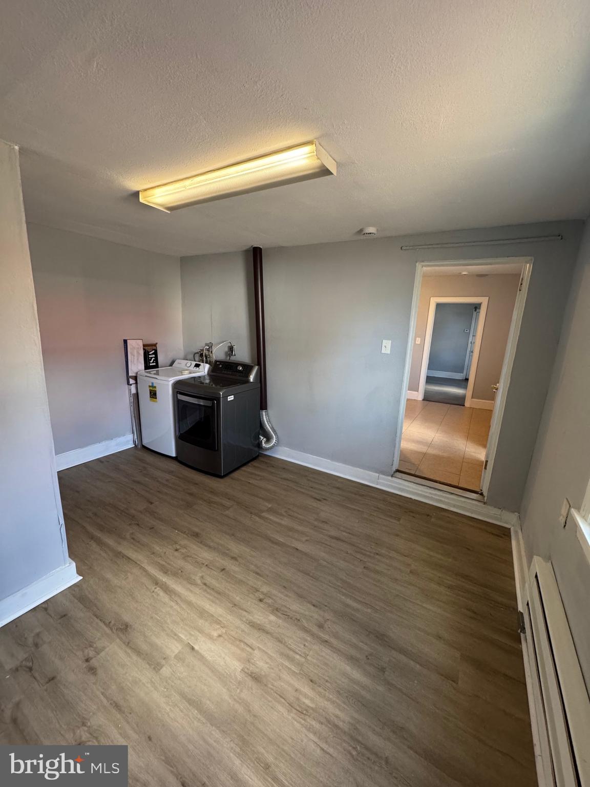 729 East Haverford Road Bryn Mawr, PA 19010 - Photo 15 of 15 a view of a living room and kitchen with furniture