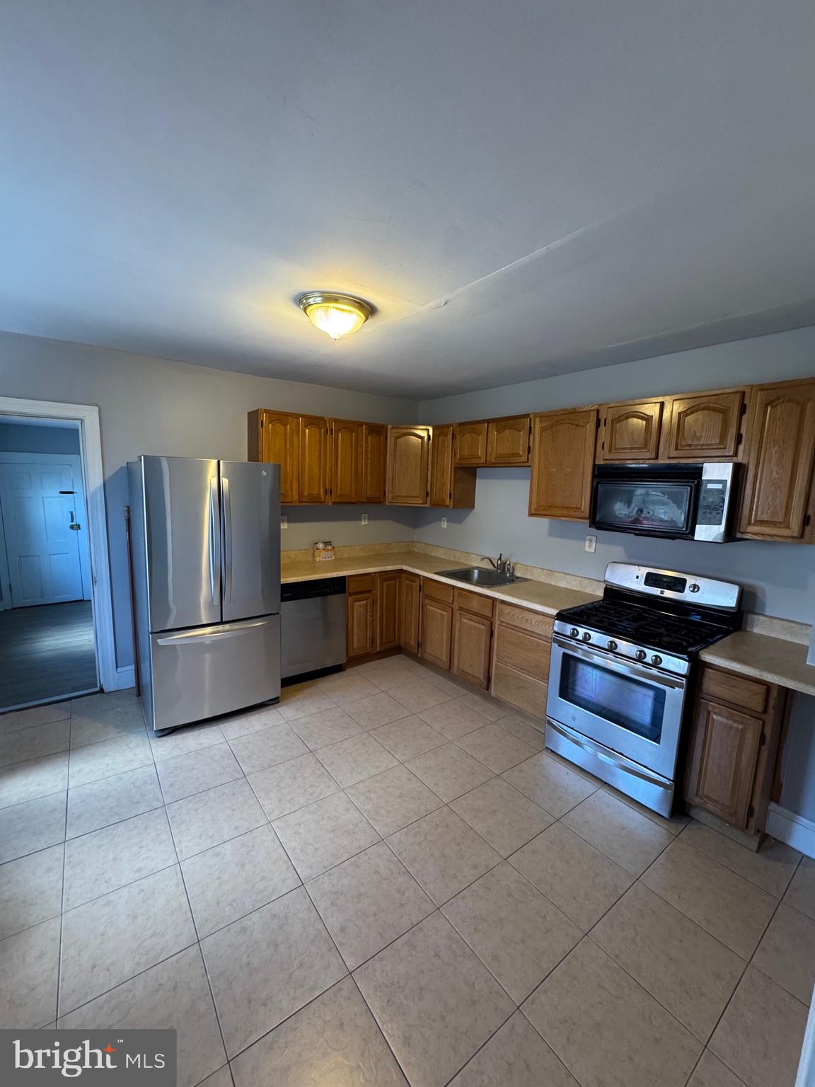 729 East Haverford Road Bryn Mawr, PA 19010 - Photo 4 of 15 a kitchen with stainless steel appliances granite countertop a refrigerator and a stove