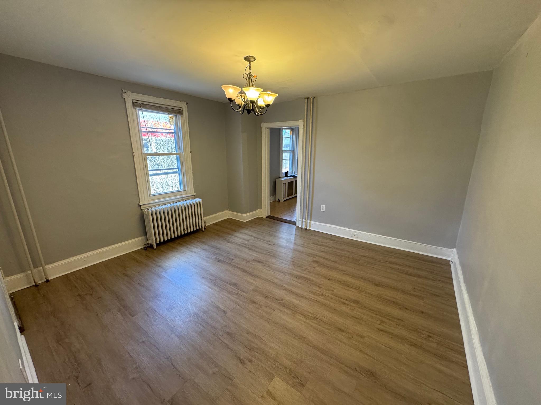 729 East Haverford Road Bryn Mawr, PA 19010 - Photo 6 of 15 a view of an empty room with wooden floor and a window