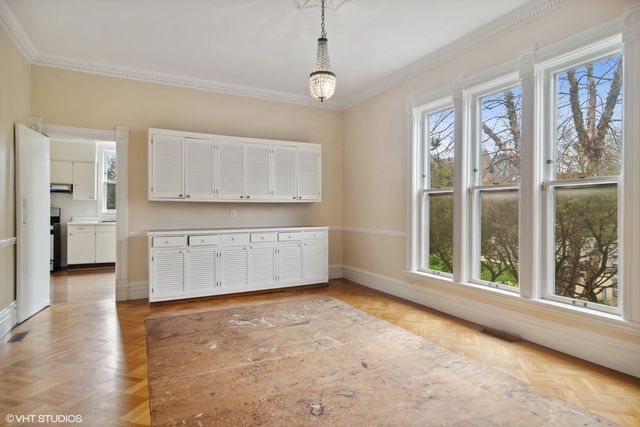 a view of a kitchen with a sink dishwasher and wooden floor