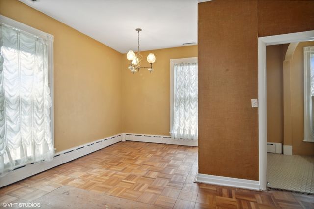 a spacious bedroom with a bed and a window