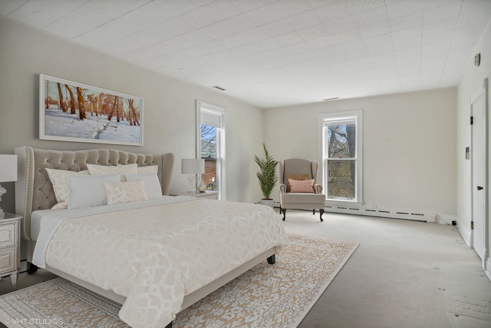 240 Beach Road Glencoe, IL 60022 - Photo 20 of 37 a bedroom with a bed a table and painting on the wall