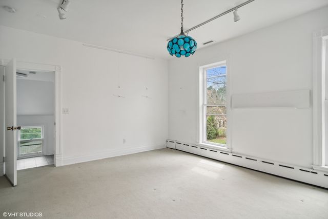 a bedroom with a bed and a table