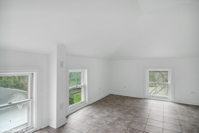 a bathroom with a toilet sink vanity and mirror