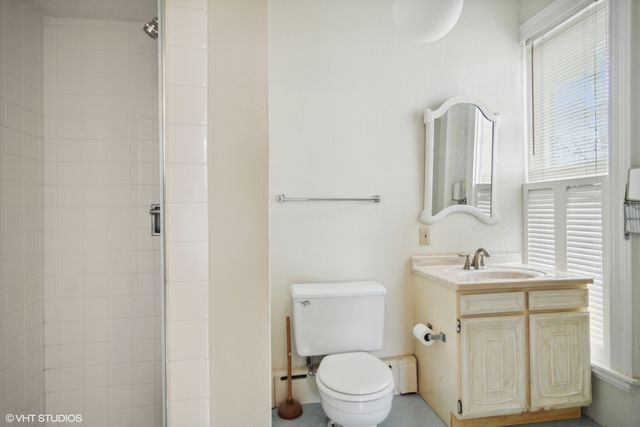 a bathroom with a sink a mirror and a shower