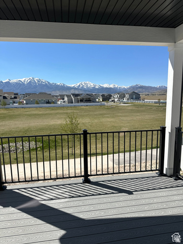 7927 Bristlecone Road, Unit 204 Eagle Mountain, UT 84005 - Photo 10 of 19 Deck with a residential view, a lawn, and a mountain view