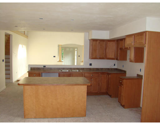 35 Little Turnpike Road Shirley, MA 01464 - Photo 11 of 22 a kitchen with stainless steel appliances granite countertop a sink and a refrigerator