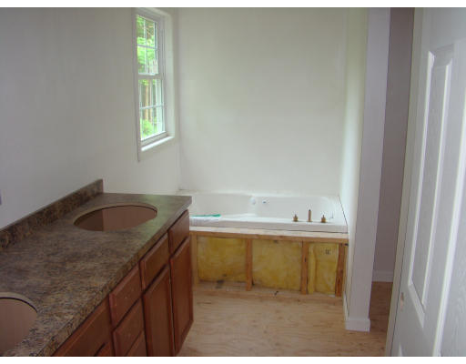 35 Little Turnpike Road Shirley, MA 01464 - Photo 14 of 22 a kitchen with a sink cabinets and a window