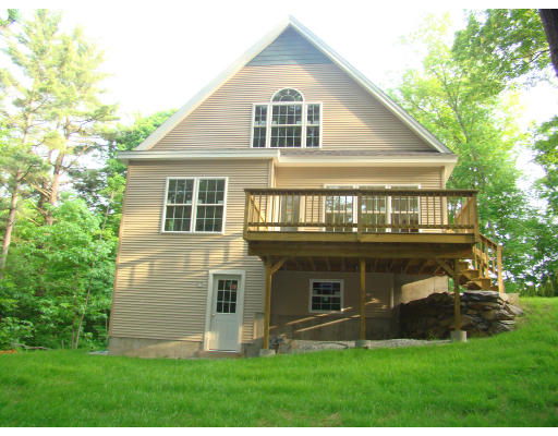 35 Little Turnpike Road Shirley, MA 01464 - Photo 6 of 22 a front view of a house with a yard and green space