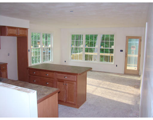 35 Little Turnpike Road Shirley, MA 01464 - Photo 10 of 22 a kitchen with granite countertop a stove and a sink
