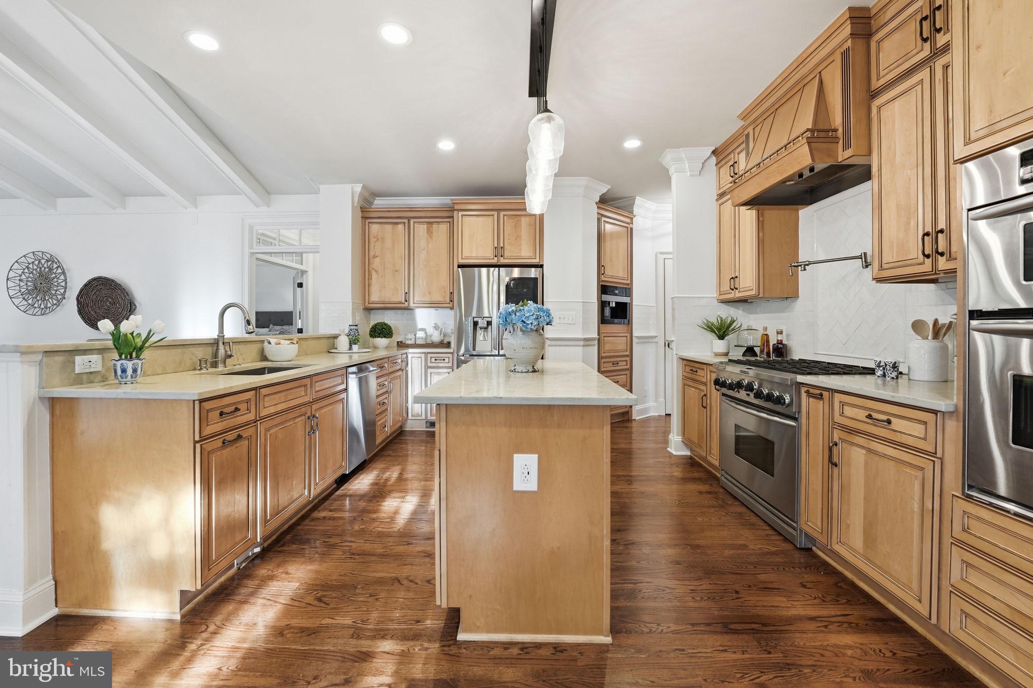 10916 Chatham Ridge Way Spotsylvania, VA 22551 - Photo 12 of 92 Warm wood tones in a spacious kitchen.
