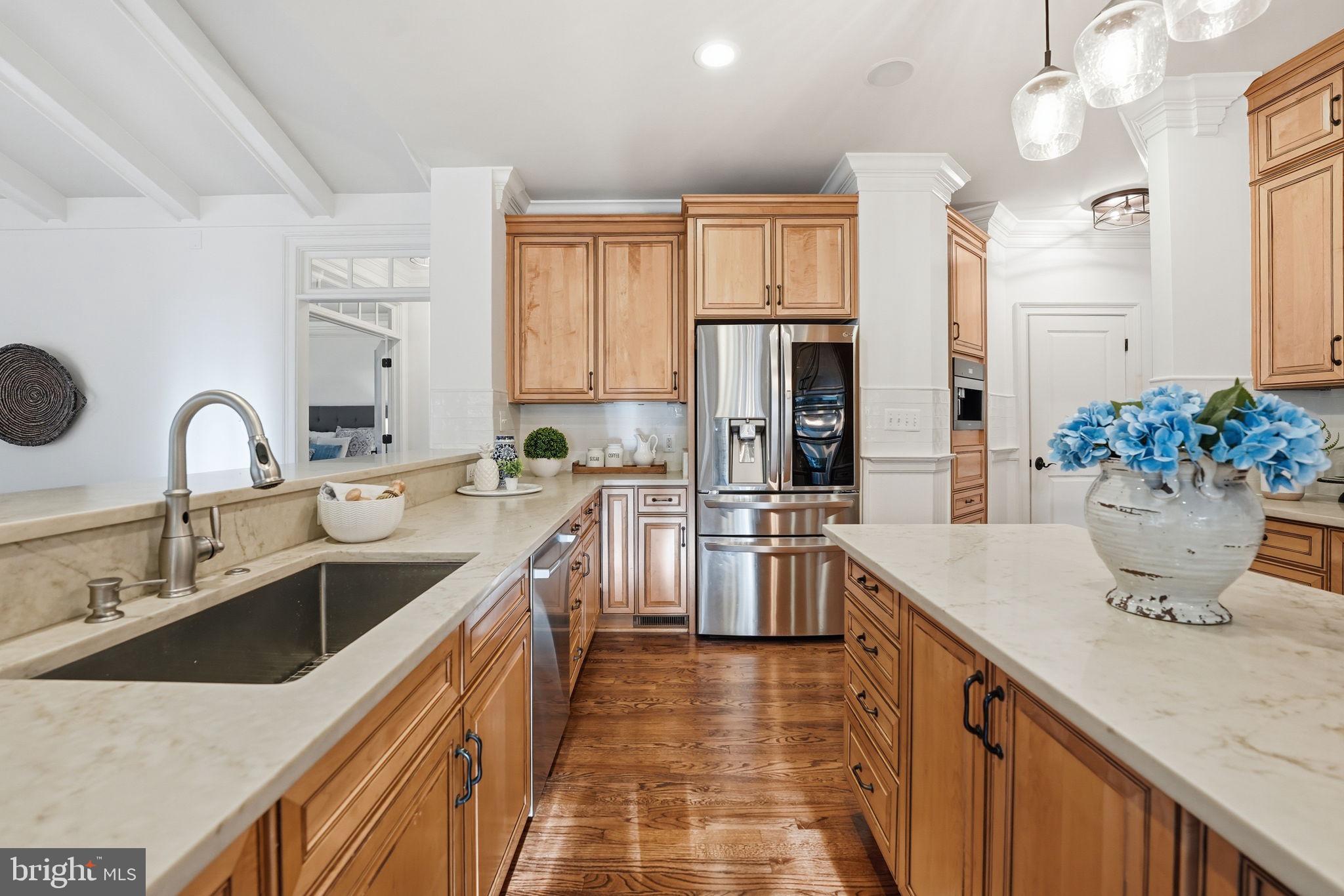 10916 Chatham Ridge Way Spotsylvania, VA 22551 - Photo 18 of 92 Elegant kitchen with warm wood tones.