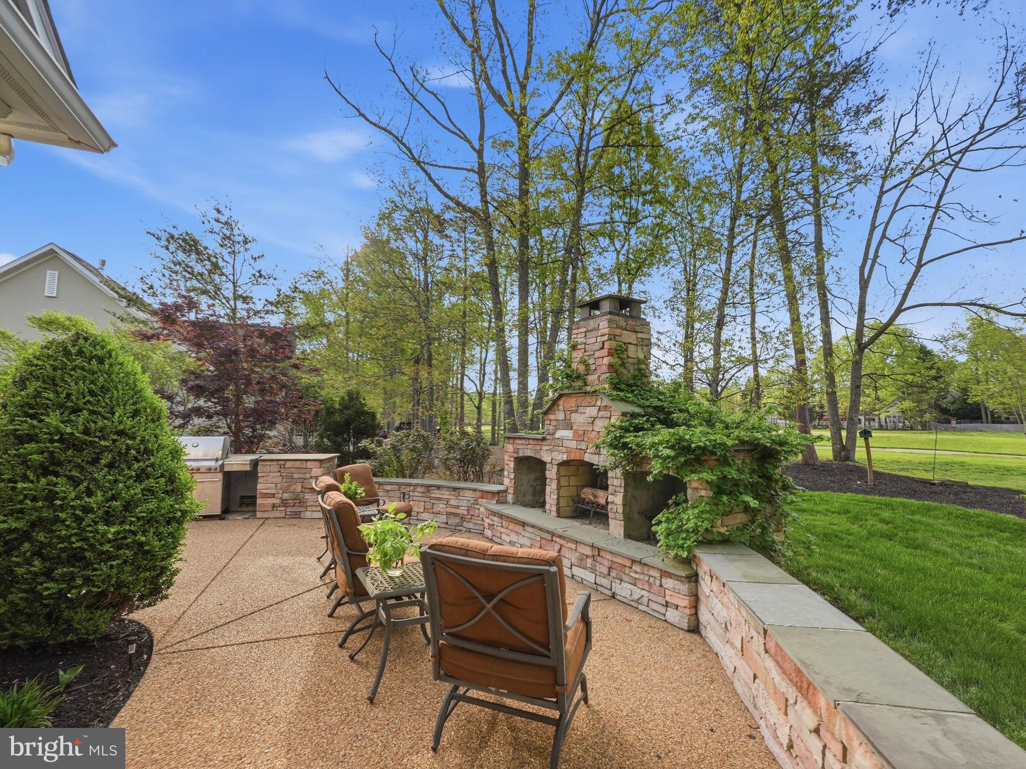 10916 Chatham Ridge Way Spotsylvania, VA 22551 - Photo 35 of 92 Serene outdoor retreat with fireplace.