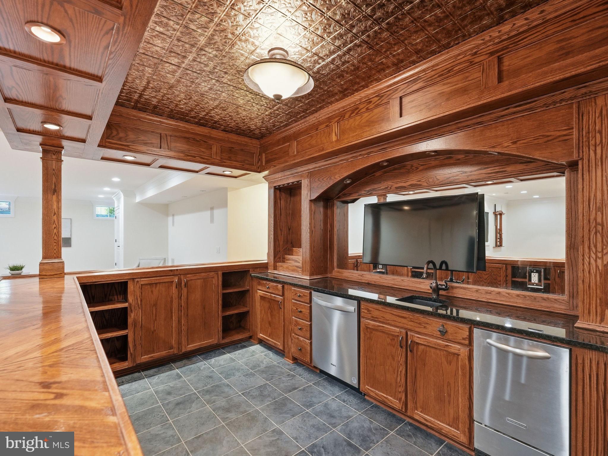 10916 Chatham Ridge Way Spotsylvania, VA 22551 - Photo 49 of 92 Elegant wood-paneled wet bar retreat.