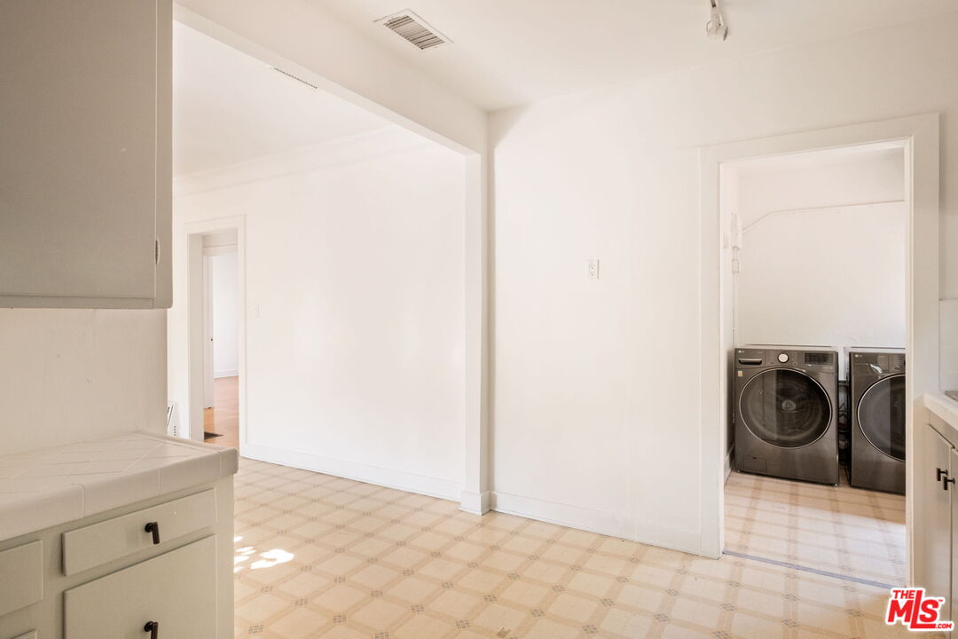 813 North Orange Grove Avenue Los Angeles, CA 90046 - Photo 12 of 42 a view of a storage & utility room with a sink