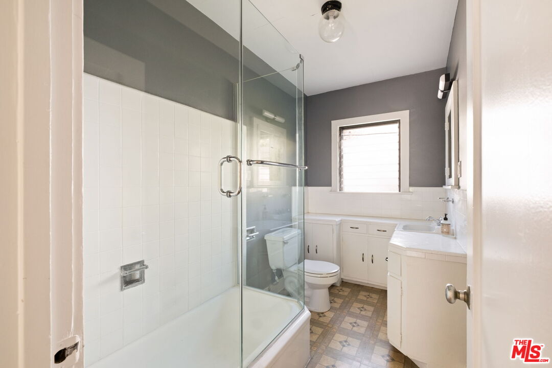 813 North Orange Grove Avenue Los Angeles, CA 90046 - Photo 20 of 42 a bathroom with a sink a toilet and shower