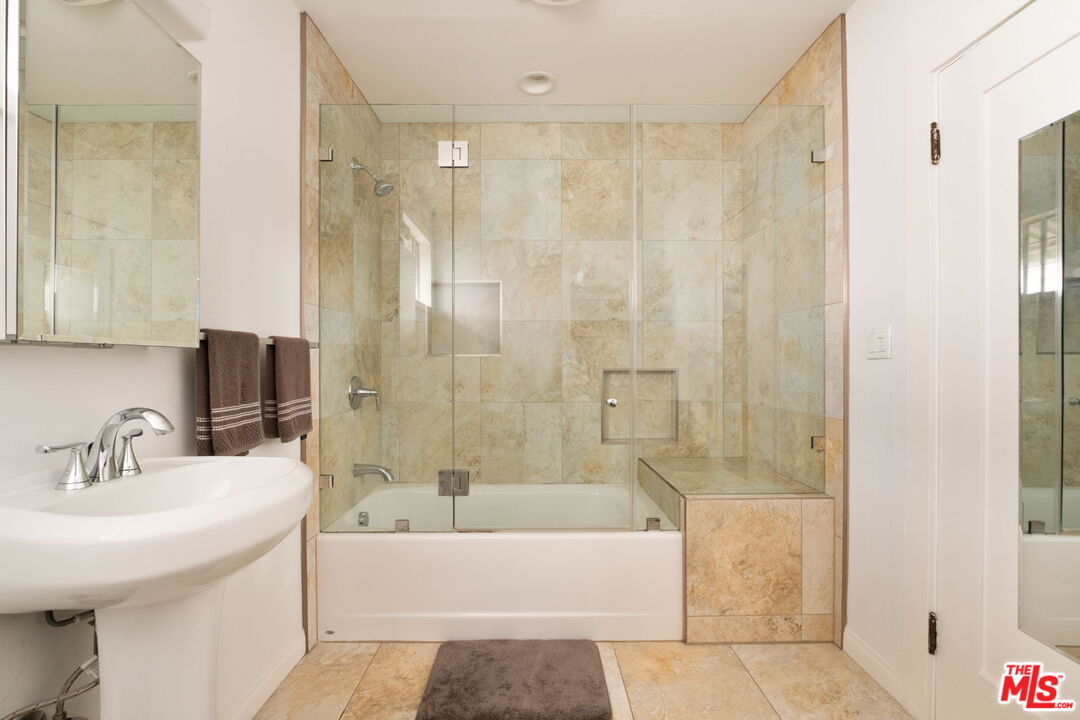 813 North Orange Grove Avenue Los Angeles, CA 90046 - Photo 31 of 42 a bathroom with a bathtub a sink and a shower