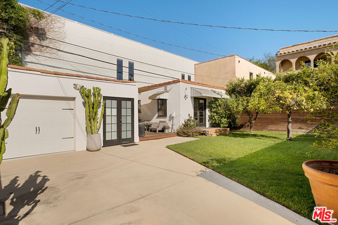 813 North Orange Grove Avenue Los Angeles, CA 90046 - Photo 36 of 42 a view of a house with a yard