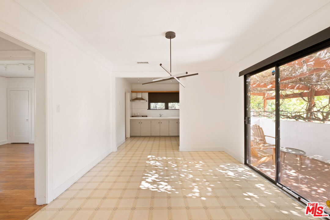 813 North Orange Grove Avenue Los Angeles, CA 90046 - Photo 7 of 42 a view of a room with a floor to ceiling window and an empty room
