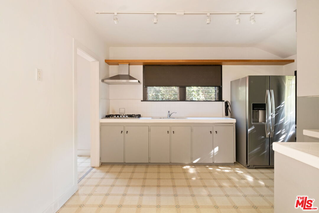 813 North Orange Grove Avenue Los Angeles, CA 90046 - Photo 10 of 42 a room with a sink cabinets and utility room