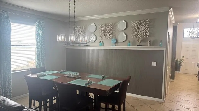 a bathroom with a granite countertop bathtub a sink and a large mirror