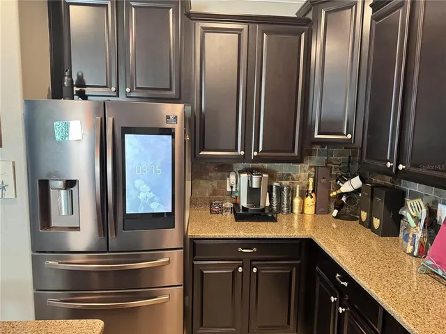 an empty room with closet and windows