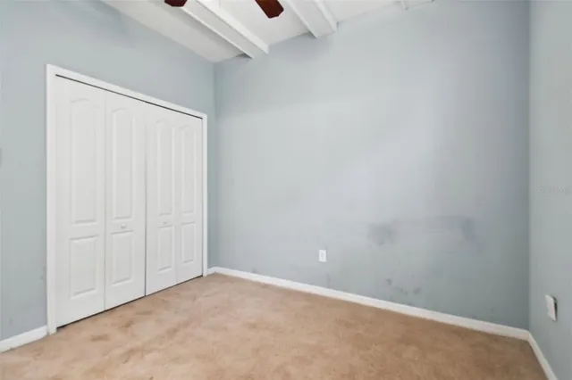 a backyard of a house with yard and outdoor seating