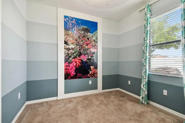 an aerial view of a house with a swimming pool