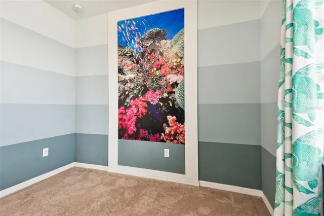 an aerial view of a house with a garden and lake view