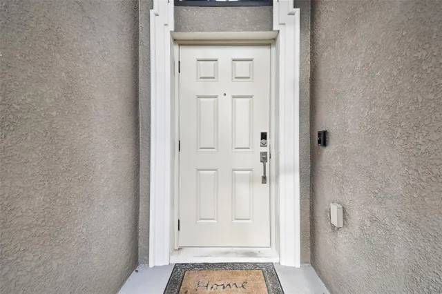 a kitchen with granite countertop wooden cabinets a stove top oven and stainless steel appliances