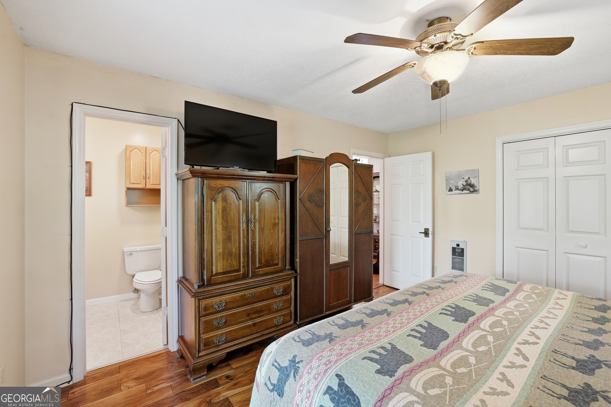 584 Battle Branch Vista Road Franklin, NC 28734 - Photo 21 of 46 a bedroom with a bed and a flat screen tv