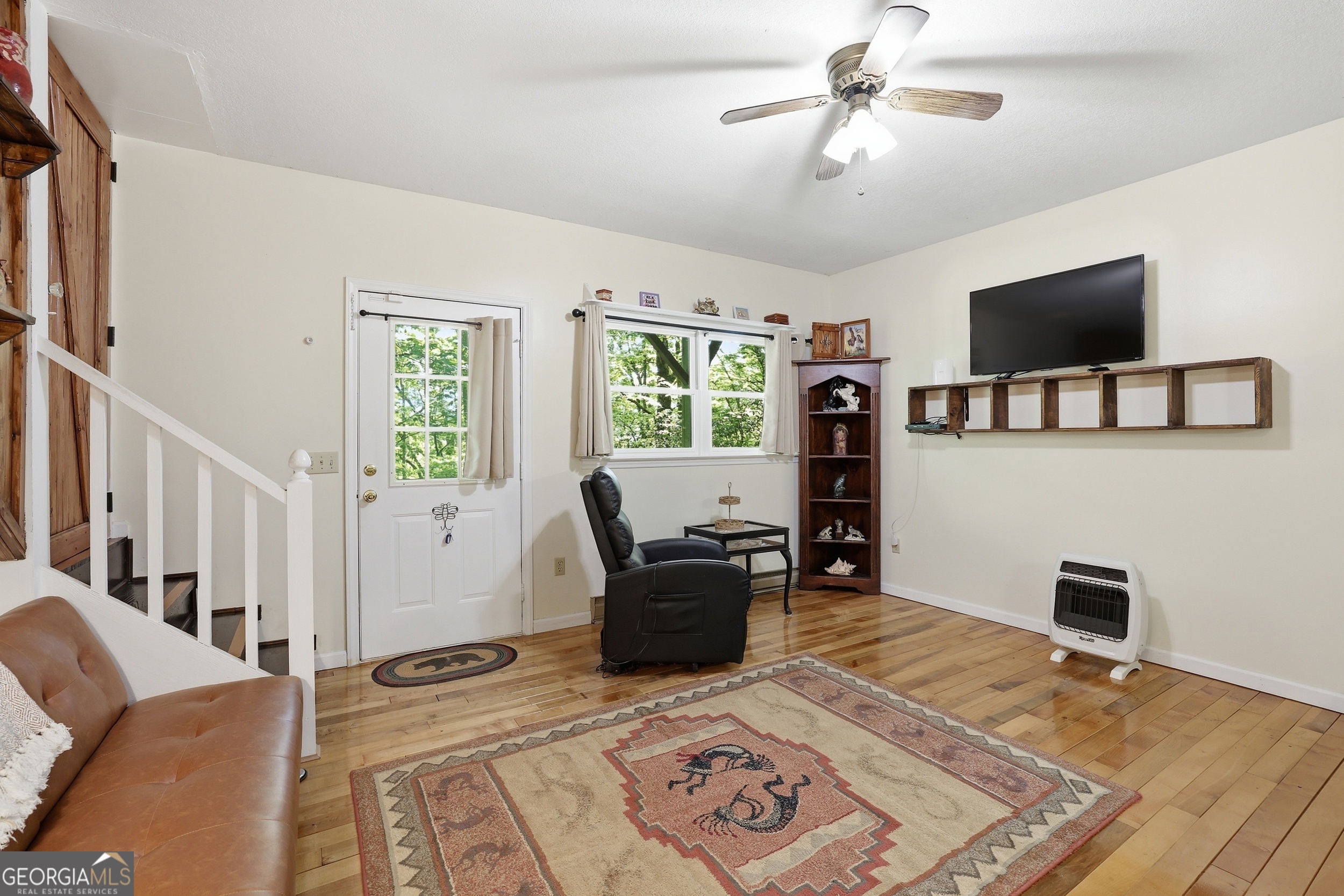 584 Battle Branch Vista Road Franklin, NC 28734 - Photo 24 of 46 a living room with furniture and a flat screen tv