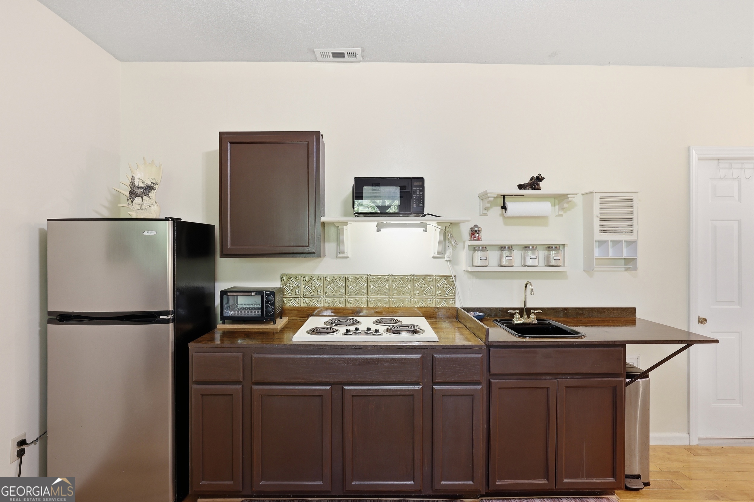584 Battle Branch Vista Road Franklin, NC 28734 - Photo 27 of 46 a kitchen with a sink refrigerator and stove