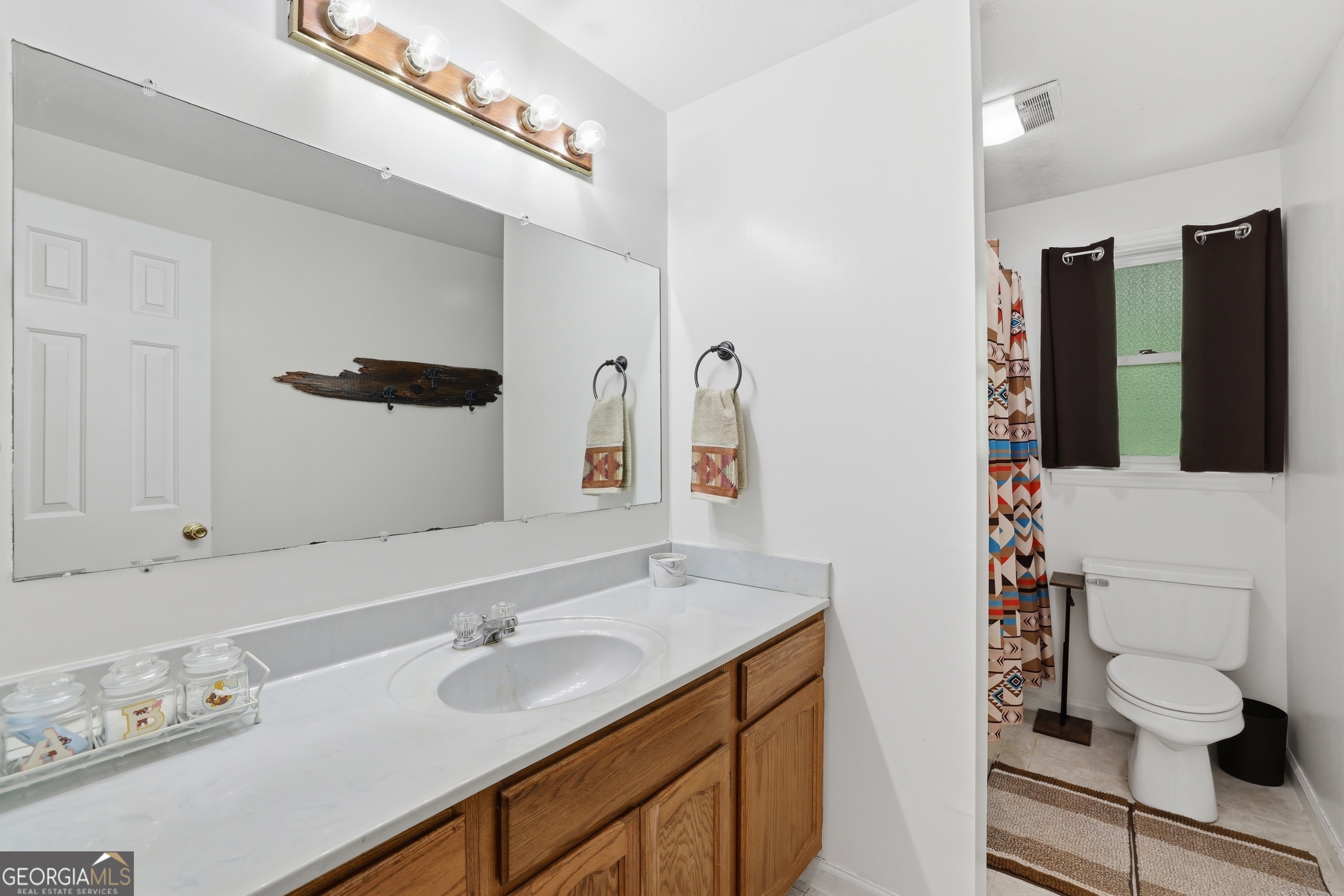 584 Battle Branch Vista Road Franklin, NC 28734 - Photo 29 of 46 a bathroom with a sink and a mirror