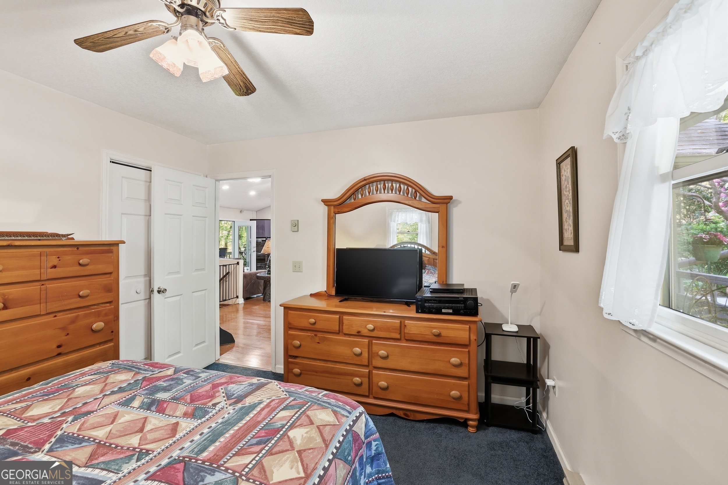 584 Battle Branch Vista Road Franklin, NC 28734 - Photo 31 of 46 a bedroom with a bed and a dresser
