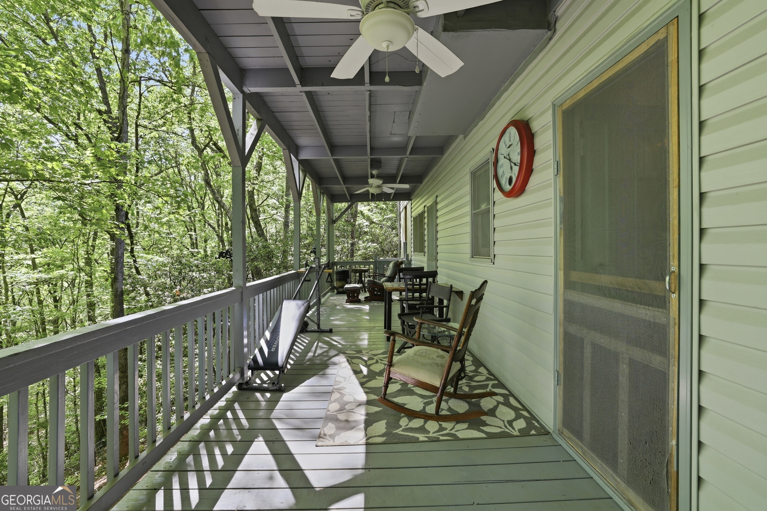 584 Battle Branch Vista Road Franklin, NC 28734 - Photo 36 of 46 a view of chairs and table in wooden balcony