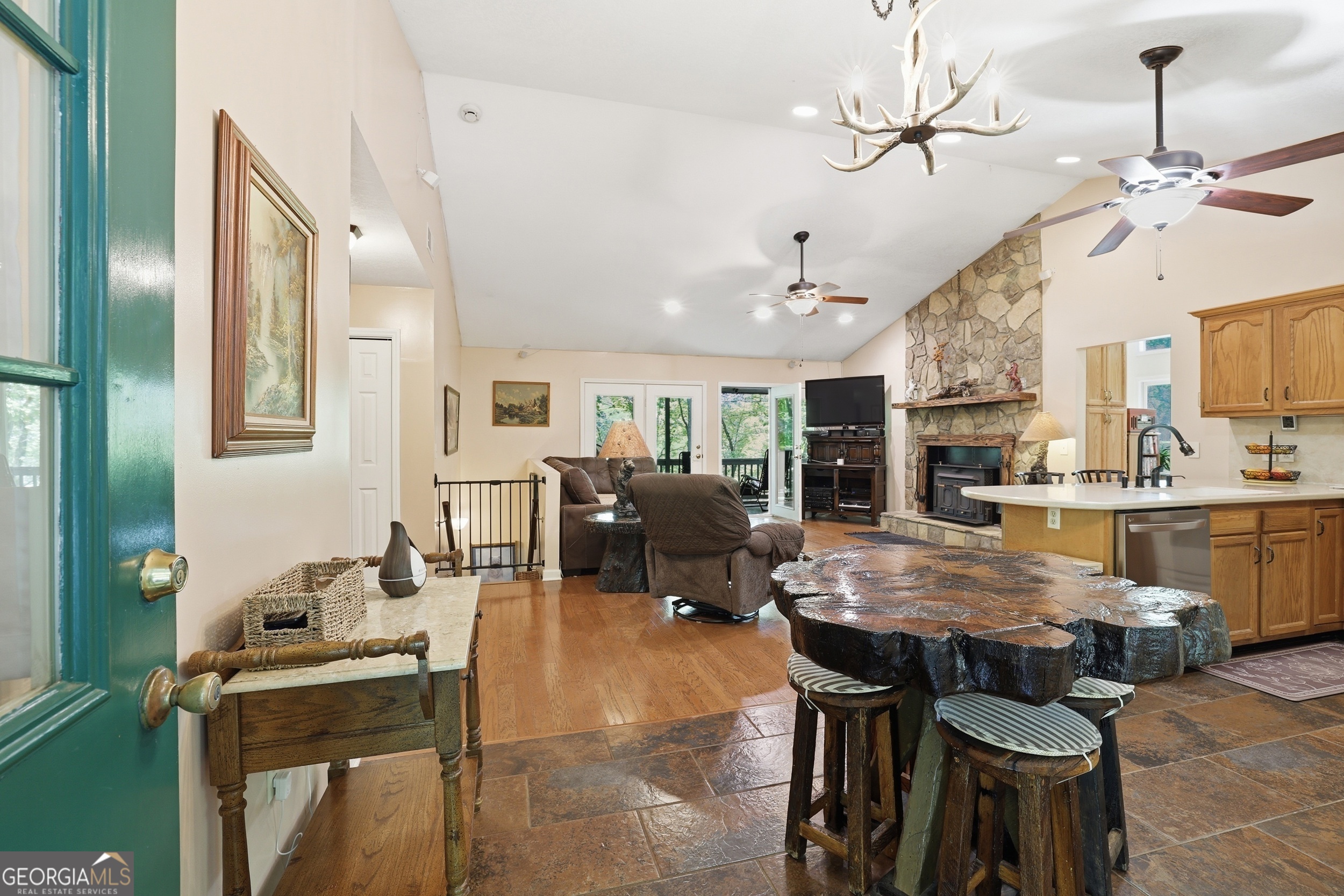 584 Battle Branch Vista Road Franklin, NC 28734 - Photo 6 of 46 a living room with furniture a chandelier and a dining table
