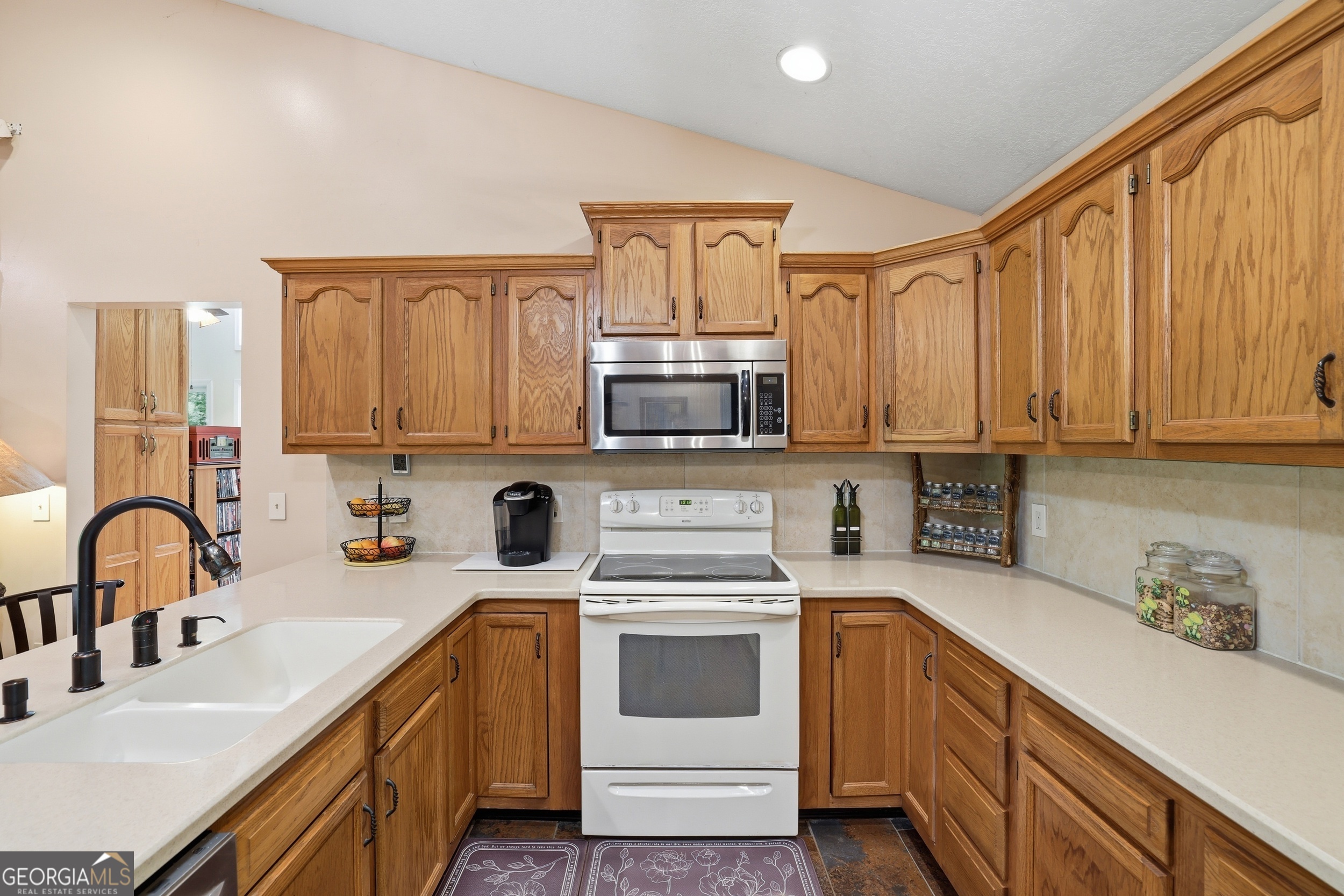 584 Battle Branch Vista Road Franklin, NC 28734 - Photo 8 of 46 a kitchen with stainless steel appliances granite countertop a sink stove and cabinets