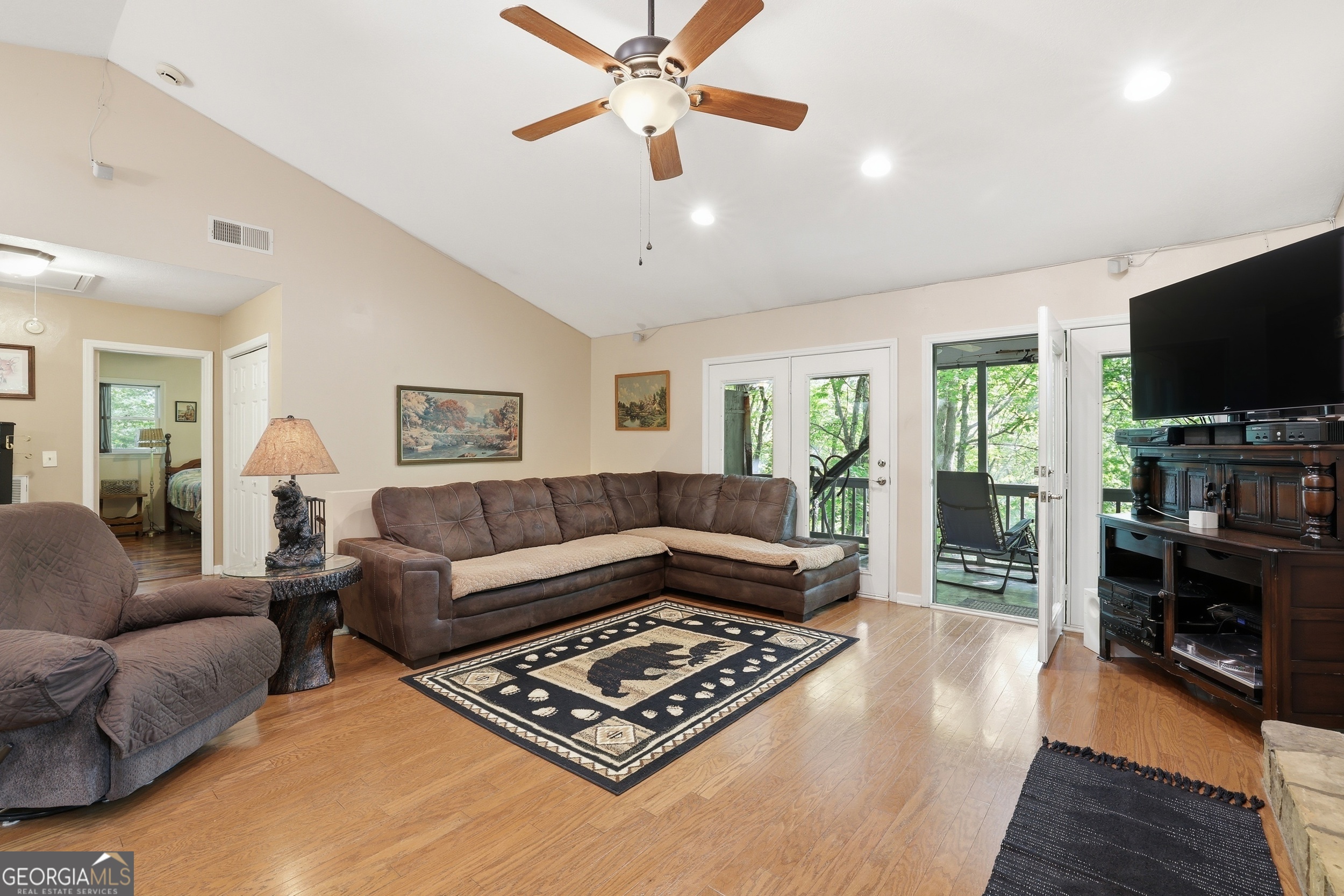 584 Battle Branch Vista Road Franklin, NC 28734 - Photo 10 of 46 a living room with furniture and a flat screen tv